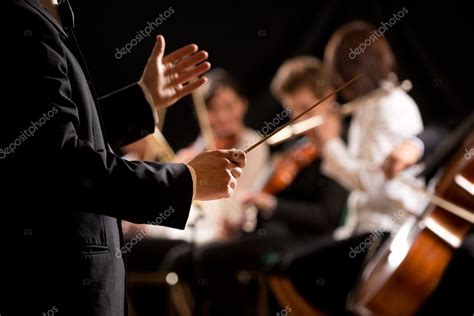 Orchestra conductor on stage — Stock Photo © stokkete #47573953