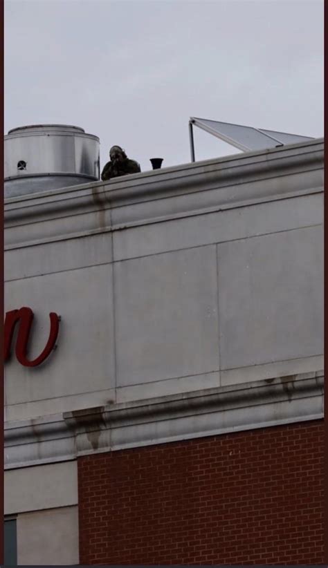 Police sniper on the roof in Portland, Maine. The police say “it’s to ...