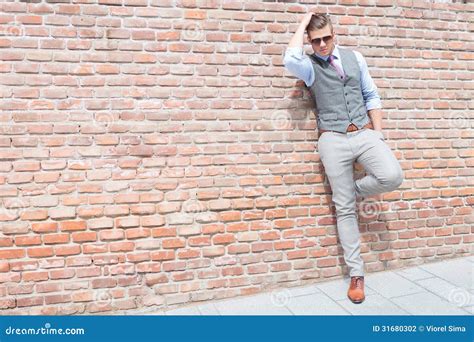 Casual Man By Wall With Hands In Pockets Stock Image | CartoonDealer.com #31160791