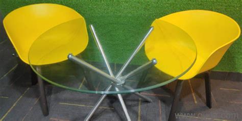 Only 2 months old glass top round tables with yellow plastic chairs | Delhi | Quikr