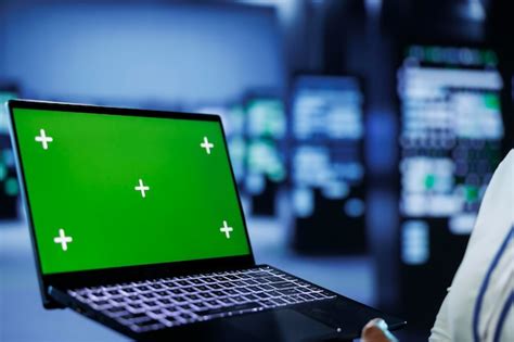 Premium Photo | Green screen laptop monitoring servers