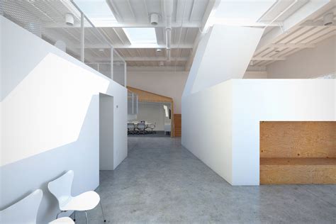 hybrid office: modern creative media office in a los angeles warehouse ...