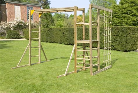 monkey bars with climbing ropes | Kids backyard playground, Backyard ...