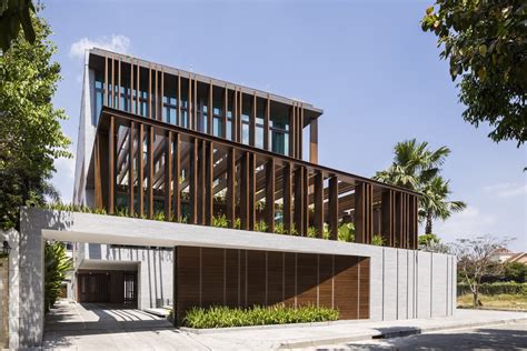 The Louvers House in Vietnam by MIA Design Studio features a unique facade and lush central ...