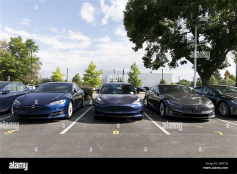 Tesla Model S and Model 3 electric vehicles at a Tesla Store location ...