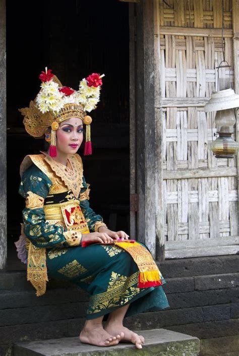 This portrait of the young Legong dancer in full costume and make up was taken at a village in ...