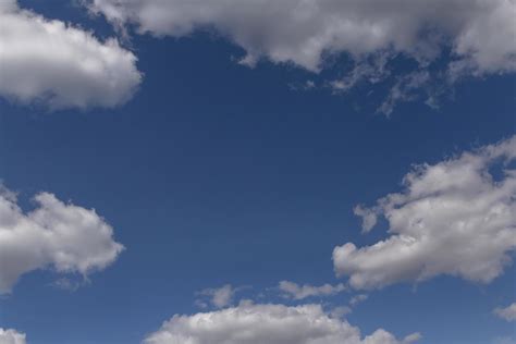 white fluffy clouds in a blue sky 21631898 Stock Photo at Vecteezy