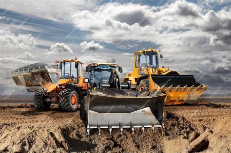 Premium Photo | Bulldozer or loader moves the earth at the construction ...