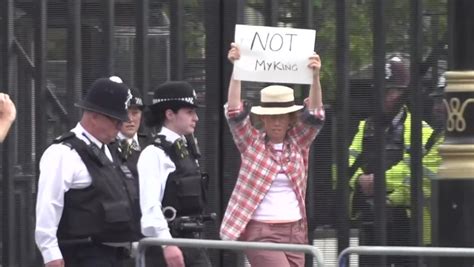 Protester with 'not my King' poster led away as Charles III addresses parliament - Mirror Online