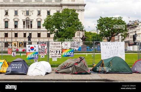 Protesters in London with tents and protest signs near Parliament and ...