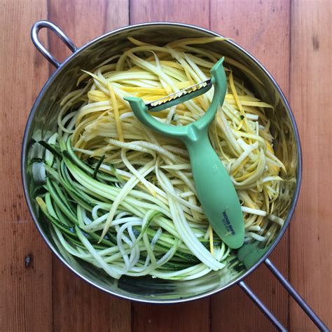 Julienne peeler used to make zucchini and summer squash noodles. Lightly salt the noodles in ...