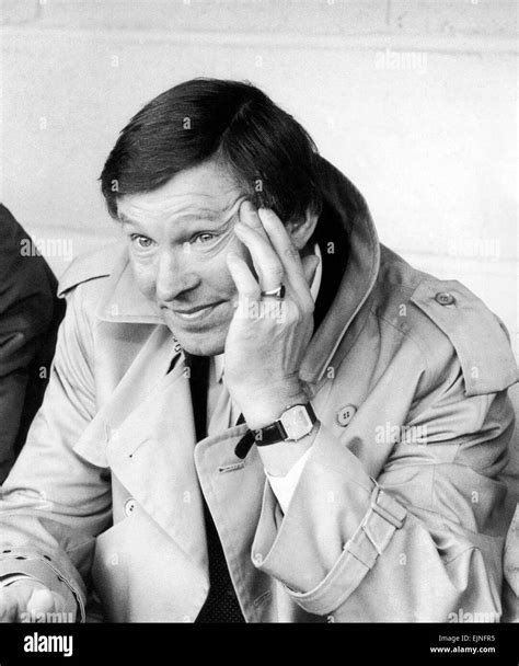 New Manchester United manager Alex Ferguson watches his side lose 2-0 against Oxford United in ...