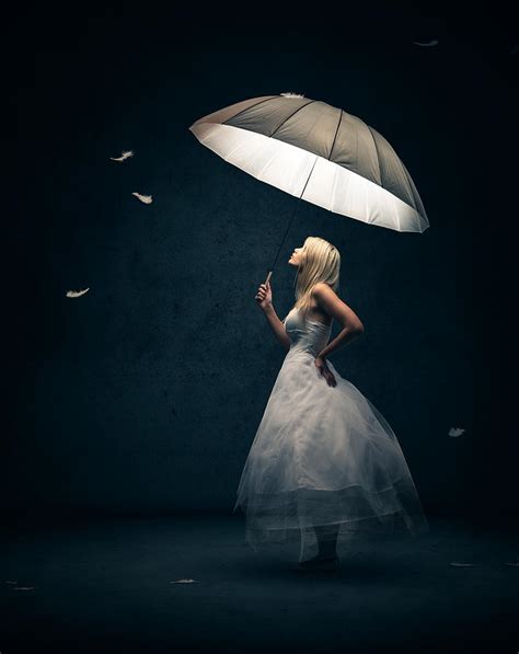 Girl With Umbrella And Falling Feathers Photograph by Johan Swanepoel