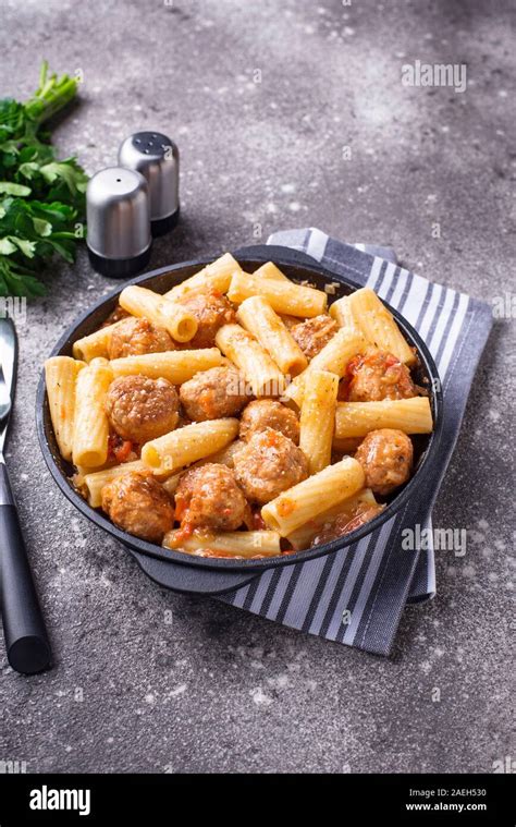 Pasta with meatballs in tomato sauce Stock Photo - Alamy