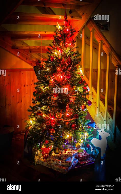 Christmas scene with tree and gifts at home Stock Photo - Alamy