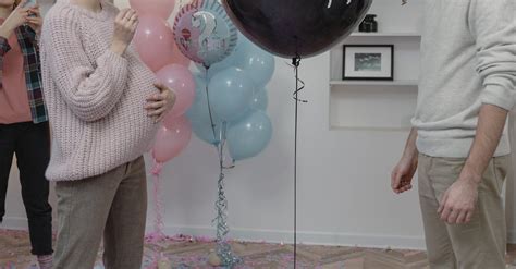 A Couple about to Pop a Balloon at a Gender Reveal Party · Free Stock Photo