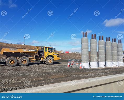 Volvo Dumper Truck on Construction Site with Reinforced Concrete Pylons ...