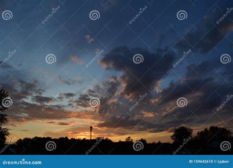 Colorful Sunset with Fluffy Clouds in the Sky Stock Photo - Image of ...