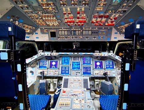 The flight deck of space shuttle Endeavour is illuminated during Space Shuttle Program ...