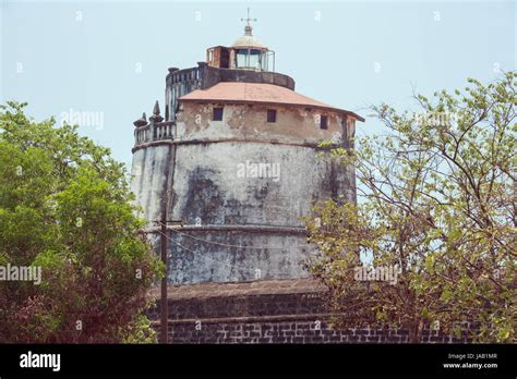 The lighthouse in Fort Aguada on the west coast of India emerging from ...