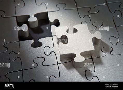 Silver puzzle pieces Stock Photo - Alamy