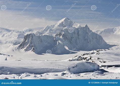 Snowy peaks stock photo. Image of rock, cloud, snow, peak - 12128606