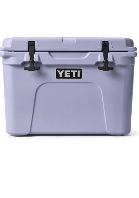 a purple yeti cooler with black handles