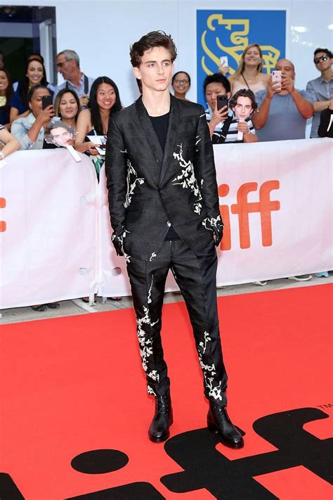 Timothee Chalamet wearing a Haider Ackermann suit at a screening of 'A ...