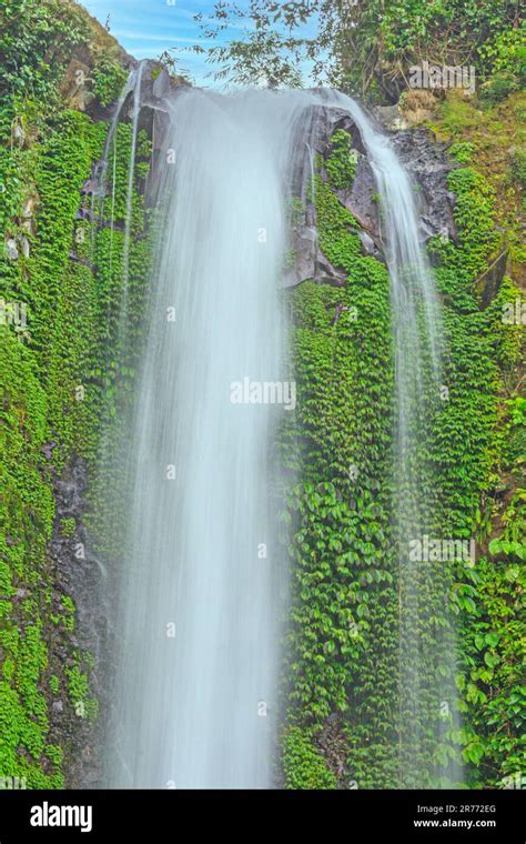 Image of a waterfall with motion blur during daytime Stock Photo - Alamy