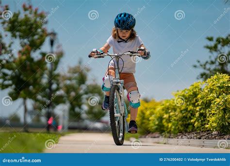 Child in Safety Helmet Riding Bike. Boy Riding Bike Wearing a Helmet ...