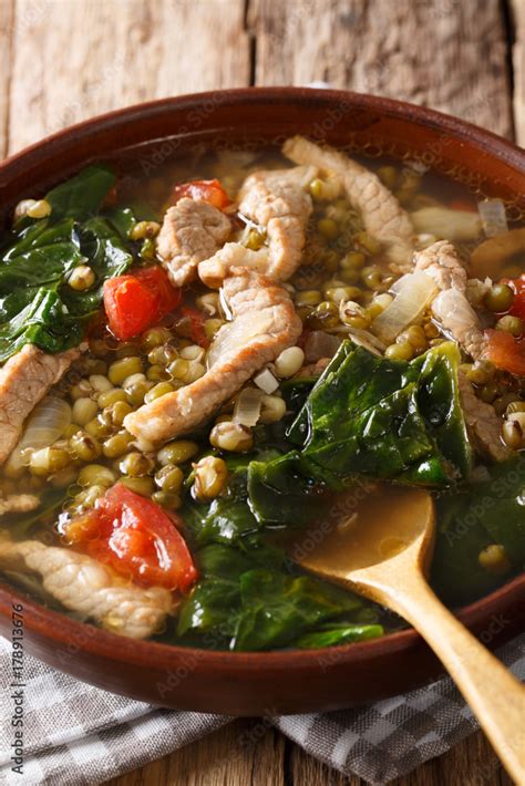 Munggo Guisado Filipino soup of beans mung closeup in a bowl. Vertical Stock Photo | Adobe Stock