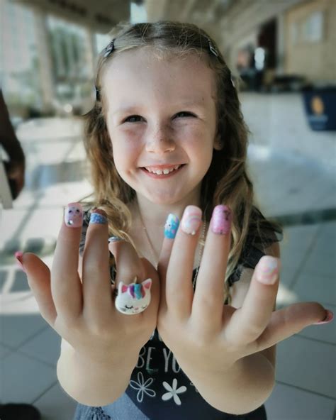 Lil' girlie with fancy nails | Norm Johnson | Flickr