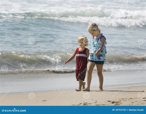 Children Walking Hand in Hand Stock Image - Image of male, shore: 10753735