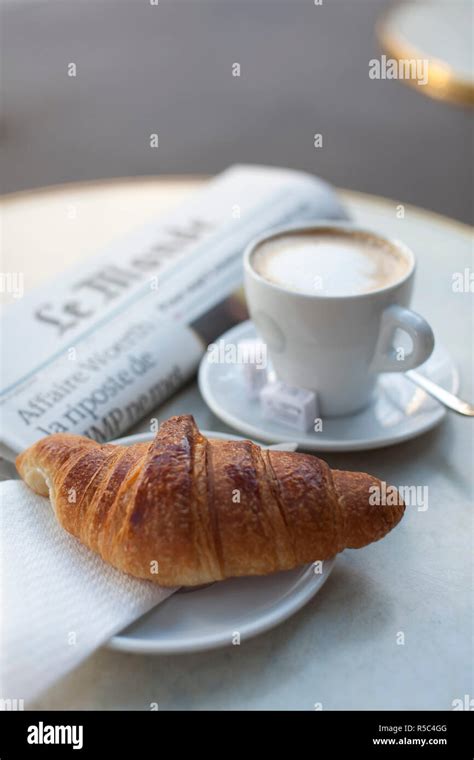Croissant and coffee in a cafe, Paris, France Stock Photo - Alamy