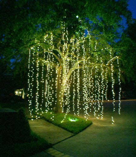 Create a willow effect by hanging mini lights from tree branches! … | Craft ideas! | Garde…