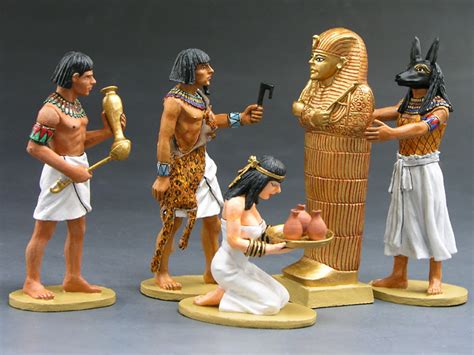 figurines of egyptian gods and pharaohs are shown