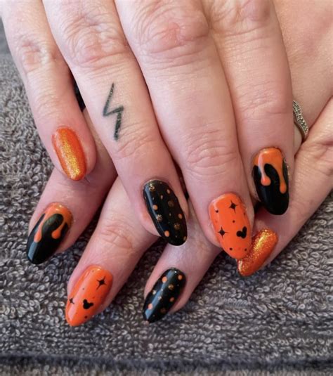 Top 11+ Black and Orange Nail Designs You Can't Miss in 2024