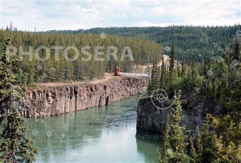 River and Pedestrian Bridge, Yukon, Canada, Early 1970’s - Photosera