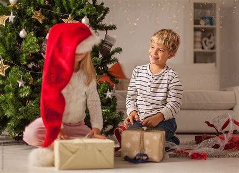 "Kids Opening Christmas Presents At Home" by Stocksy Contributor ...