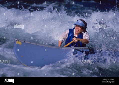 woman whitewater canoeing Martins Rapids McKenzie River Oregon USA ...