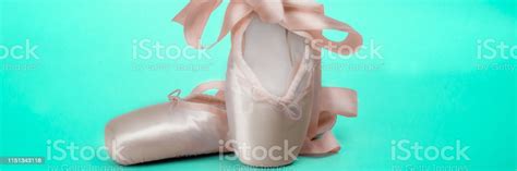Pointe Shoes Ballet Dance Shoes With A Bow Of Ribbons Beautifully Folded On A Green Background ...