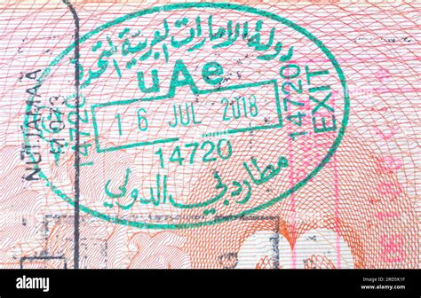 UAE border crossing stamp in an open passport. United Arab Emirates exit passport stamp. Dubai ...