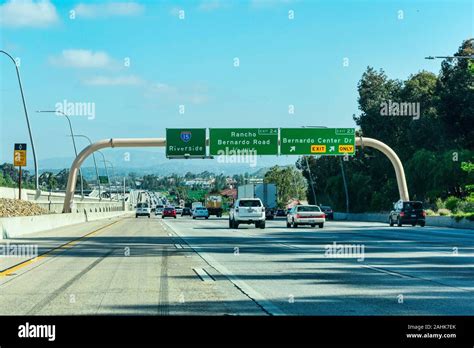 Guide signs on large overhead signage informing drivers about the intersections and highways ...