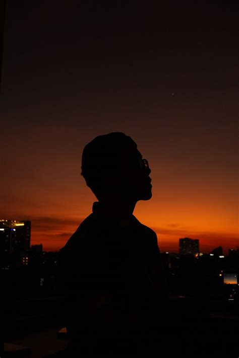 Silhouette Of Person Holding A Camera · Free Stock Photo