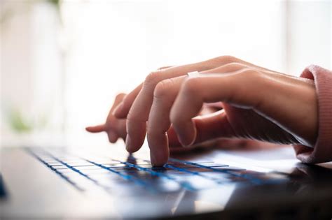 Premium Photo | Low angle closeup view of female hands typing on laptop computer