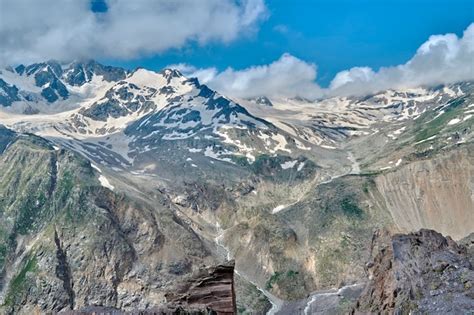 Premium Photo | View of the caucasus mountains and peaks covered with snow