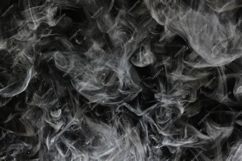 Premium Photo | Texture smoke on a black background abstract