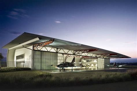 Material Efficient Plane Hangar & Museum Takes Inspiration From a Wing ...