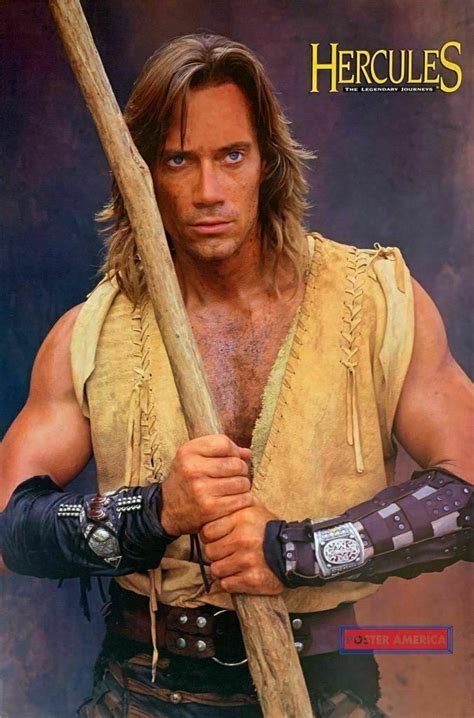 an autographed photo of a man holding a baseball bat in his hand and wearing leather gloves