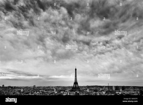 Paris, France skyline with Eiffel Tower. Dark clouds, black and white ...